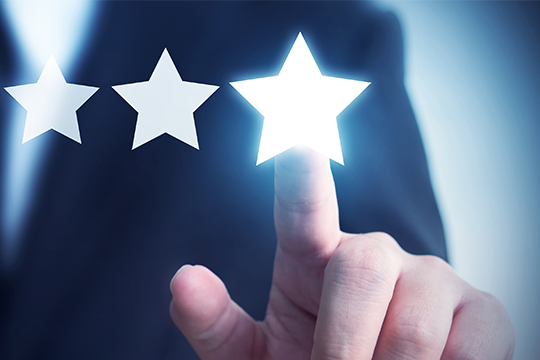 man pressing 3 star rating