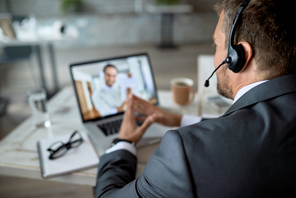 Man in conference with VoIP